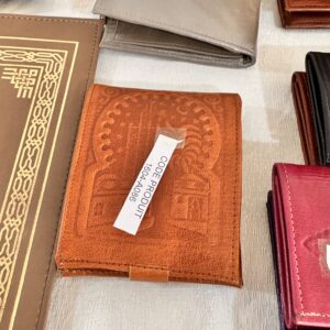 Small embossed leather purse, ochre color.