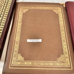 Leather flap folder with gold decoration.