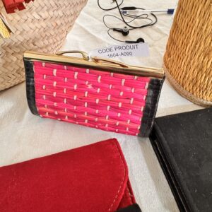 Rigid pouch in bright pink leather and raffia.