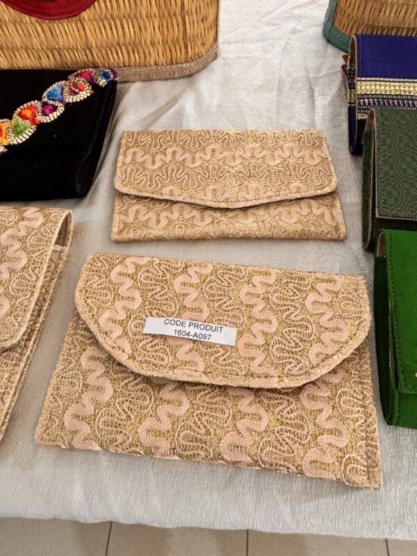Beige gold embroidered pouch with curved flap.
