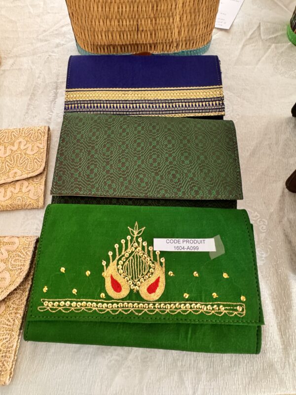 Green pouch decorated with gold and red embroidery.