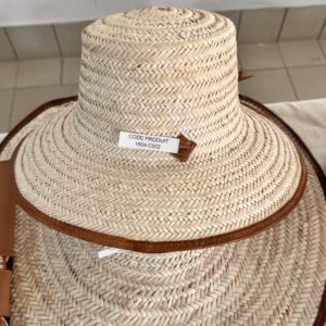 Handmade hat made of plant fiber with a wide leather border.