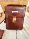 Elegant brown rigid leather bag