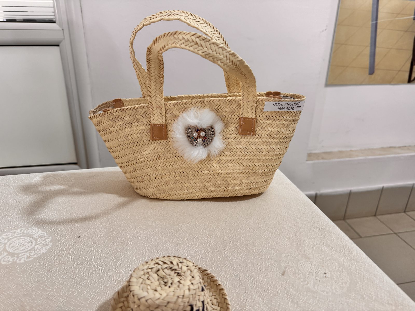 Petit cabas en palmier à pompon