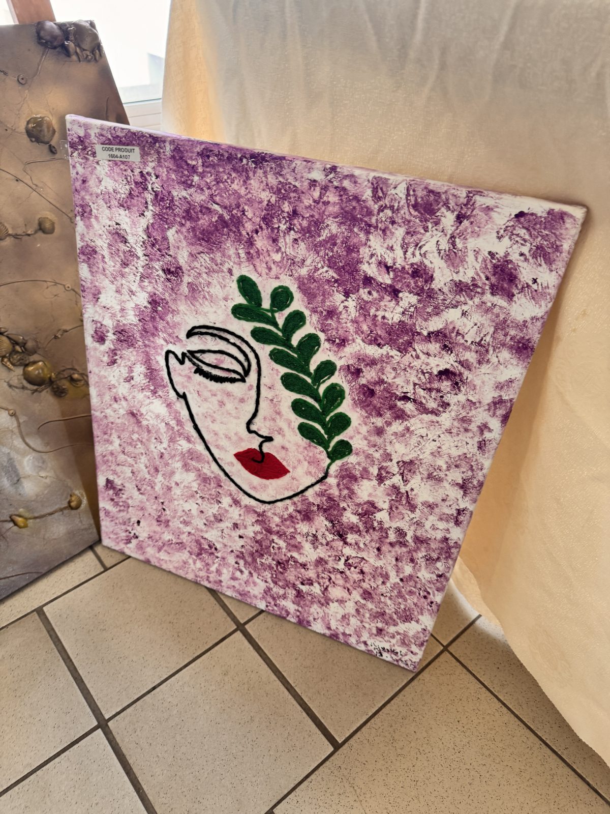 Toile « Visage au feuillage »