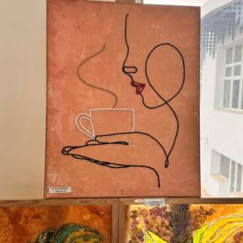 Toile « Visage au café »