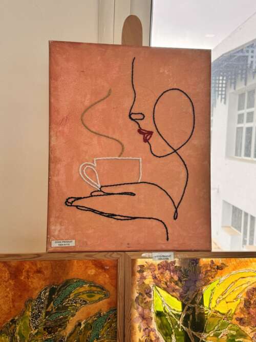 Toile « Visage au café »